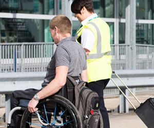 Special Assistance employee assisting a passenger at Bristol Airport