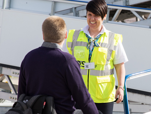 OCS employee greeting a passenger at Bristol Airport